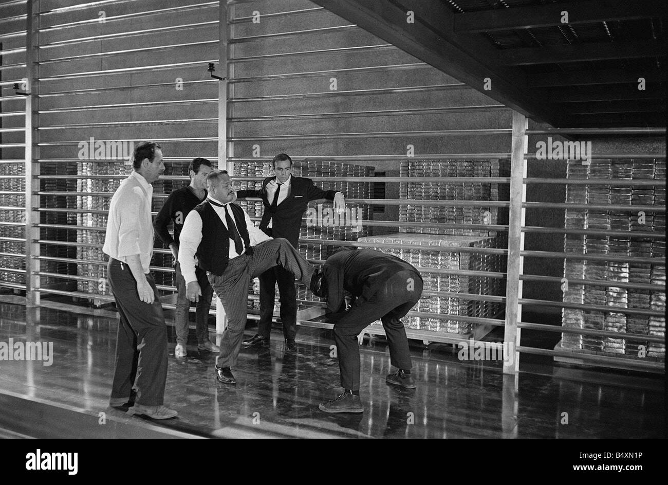 Film Goldfinger 1964 Sean Connery as James Bond 007 receives instuction from the director on the fight sequence with Goldfinger Stock Photo