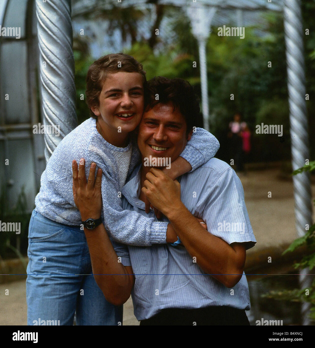Shakin Stevens singer July 1986 being cuddled by Connie Taylor Connie was  in a coma and Shaky visited her Stock Photo - Alamy