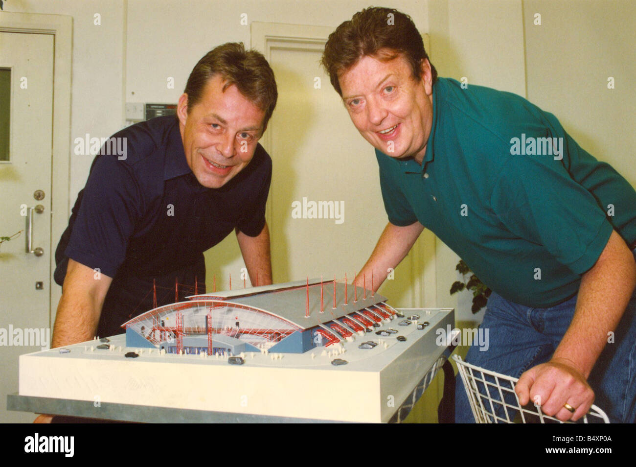 Former bassist of The Animals pop group Chas Chandler right pictured with architect Nigel Stanger talks about the building of the Newcastle Arena 07 08 92 Stock Photo