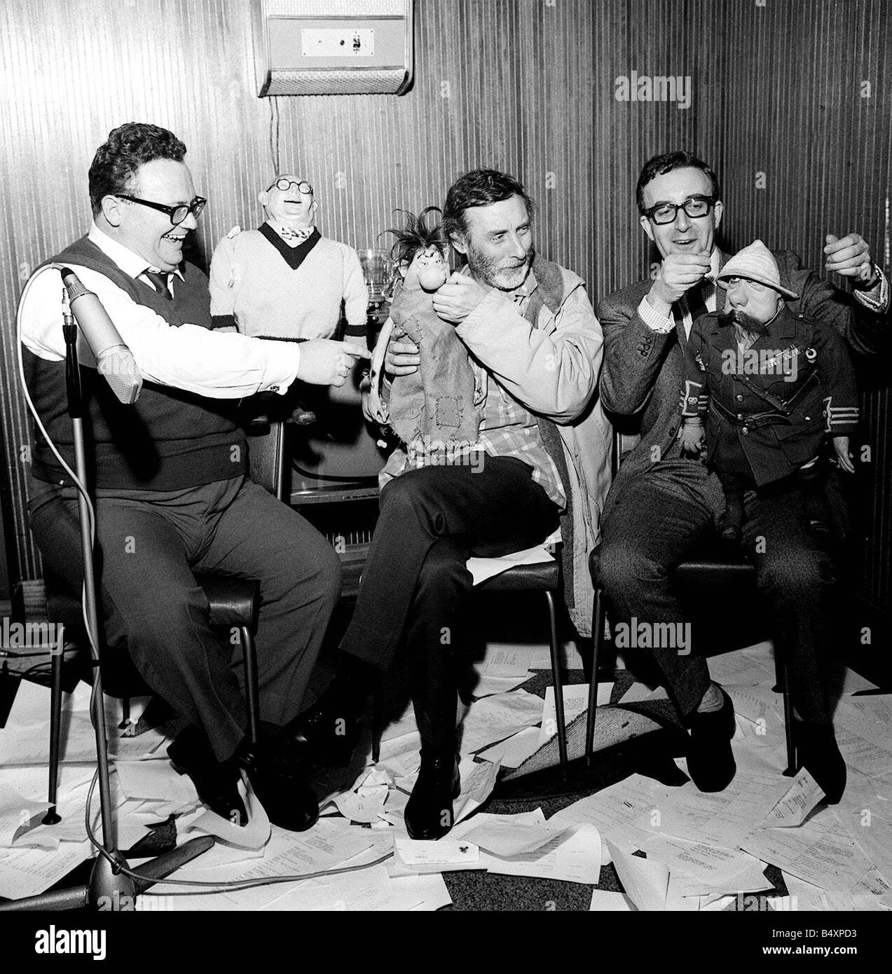 The Goons Harry Secombe Spike Milligan and Peter Sellers holding the tellygoons puppets Stock Photo