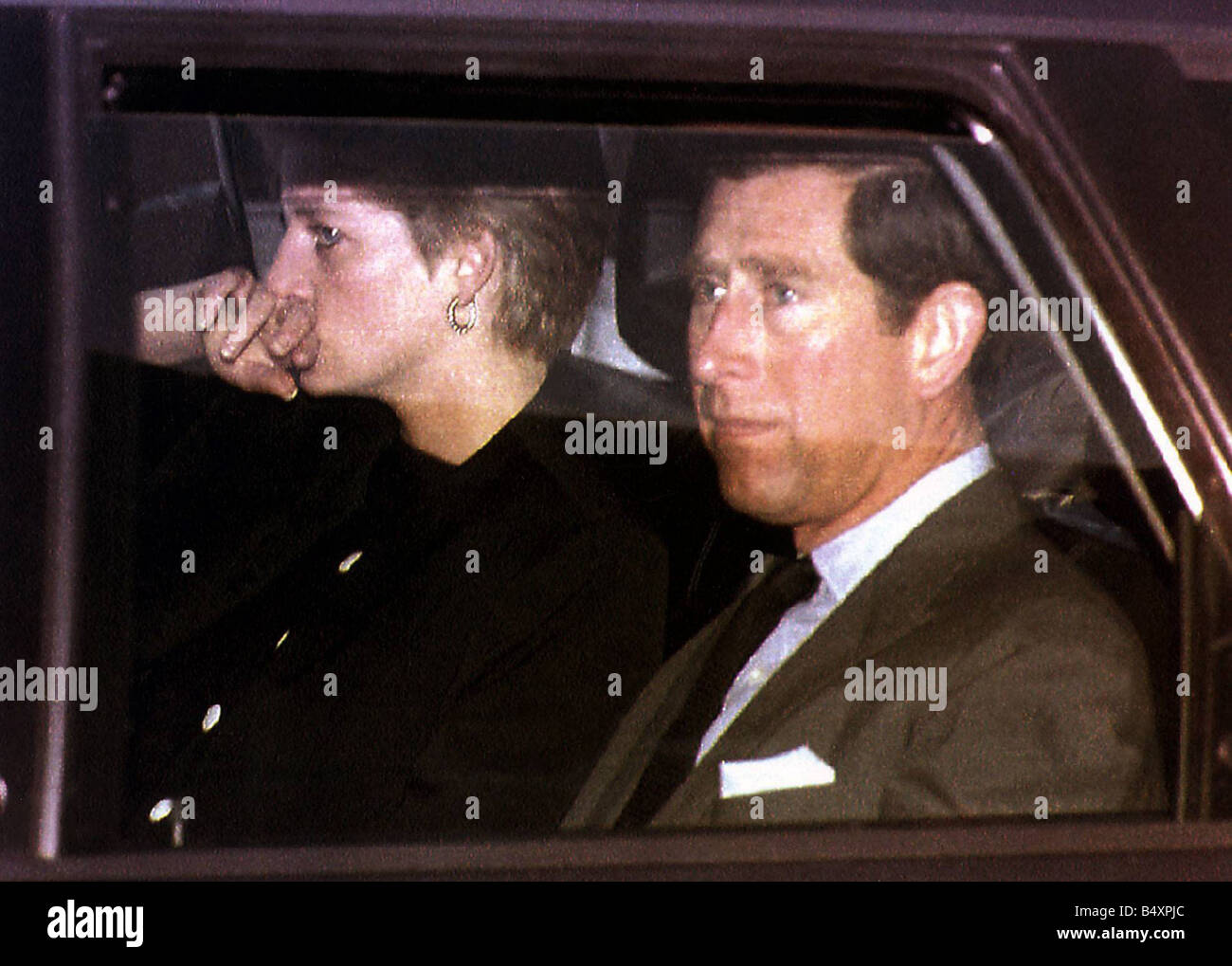 Prince Charles and Princess Diana leaving Lech Austria in 1992 for home pictured in the back of a car with Diana grieving over her father Stock Photo