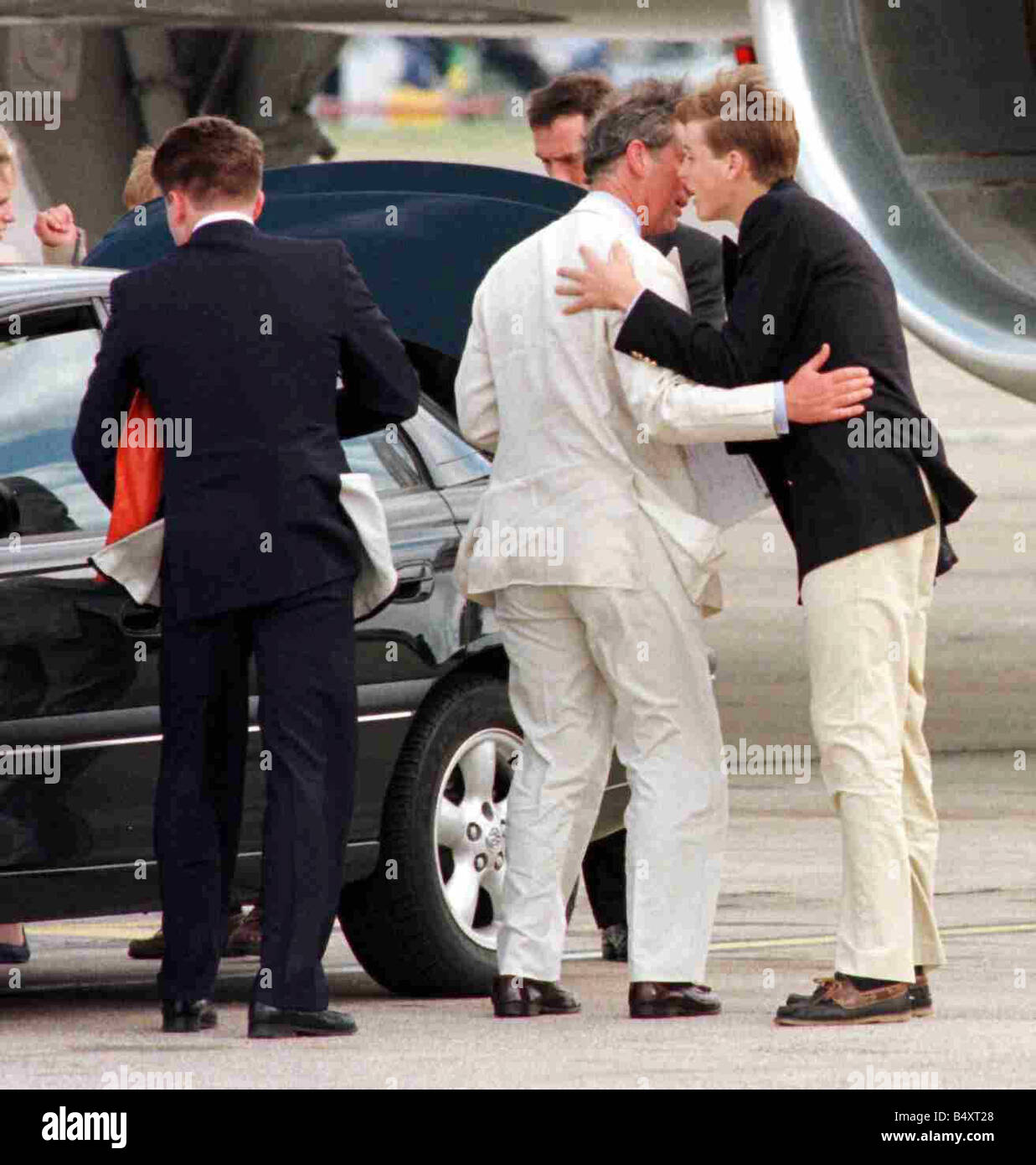 Prince Charles August 1998 and Harry leave Heathrow for Athens on one aircraft whilst William travels on another with Tiggy Legge Bourke Charles bids farewell to William as they board seperate flights to Athens Stock Photo