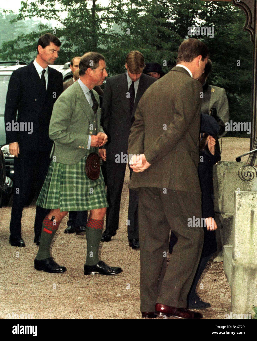 Prince William and Prince Charles attend a private prayer service at Crathie Kirk near Balmoral on the 1st anniversary of the death of Princess Diana Stock Photo