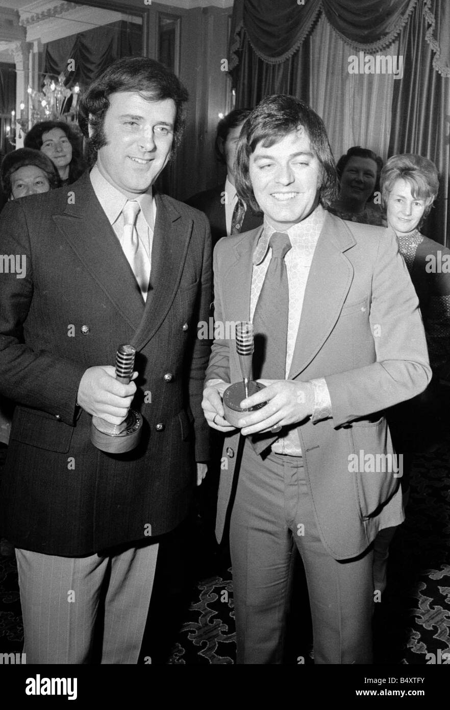BBC radio braodcasters Terry Wogan left and Tony Blackburn winners of the Reveille Top of the Poll of DJs of Radio One and Two respectively pictured with their Oscar awards at the presentation lunch at Cafe Royal November 1972 Mirrorpix Stock Photo