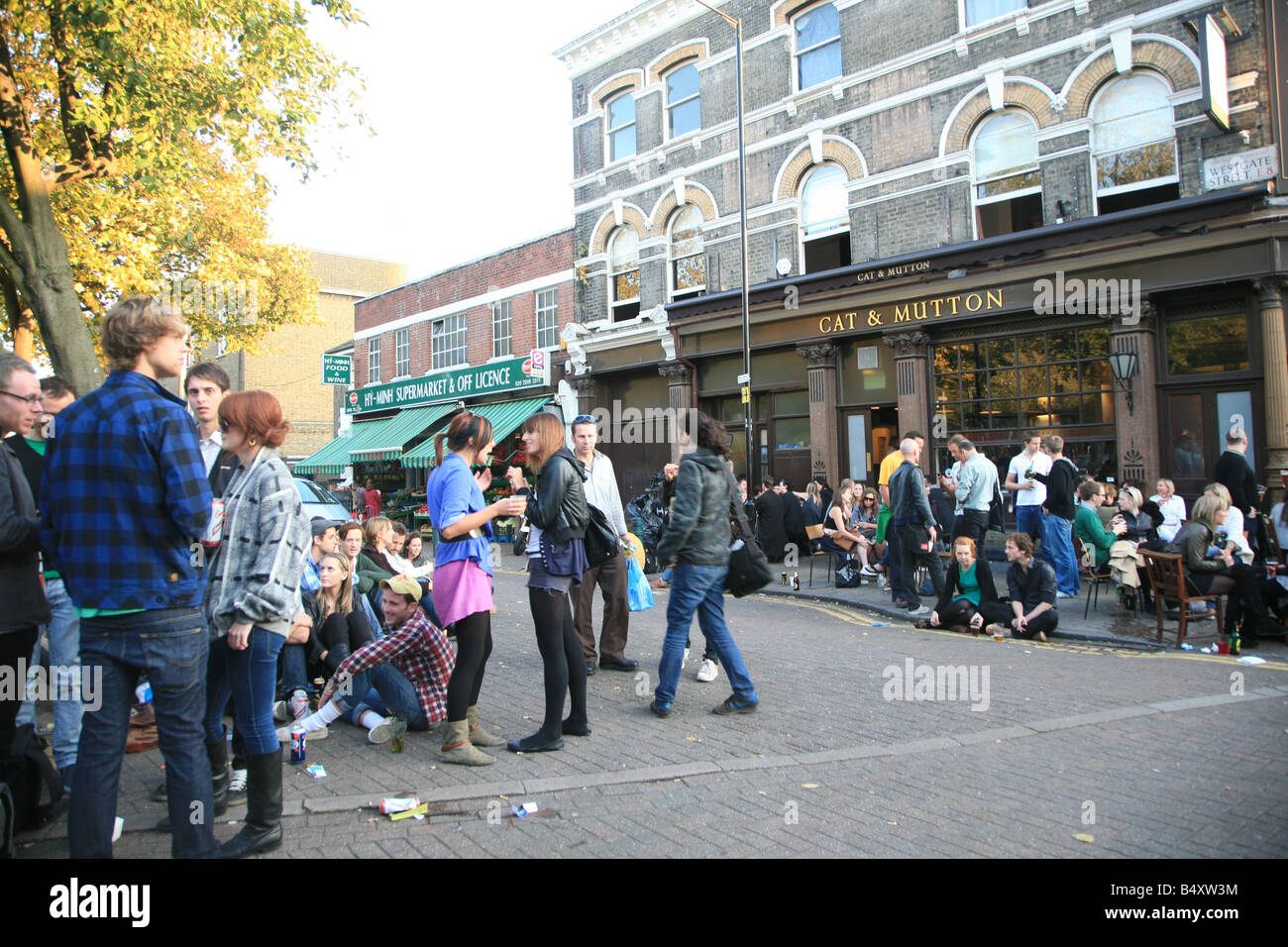 Group of people having a drink outside the Cat & Mutton Bar , Broadway Market Hackney UK 2008 Stock Photo