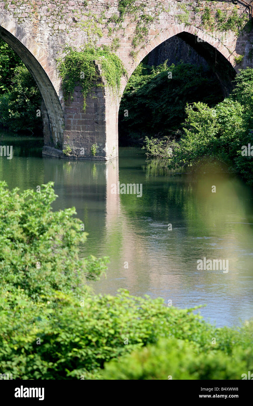 Bridge spanning river Stock Photo - Alamy