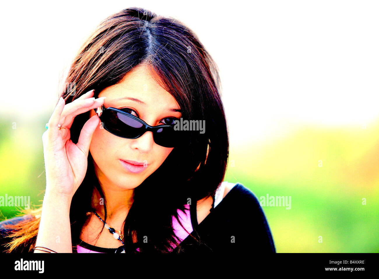 Young woman wearing sunglasses, portrait Stock Photo - Alamy