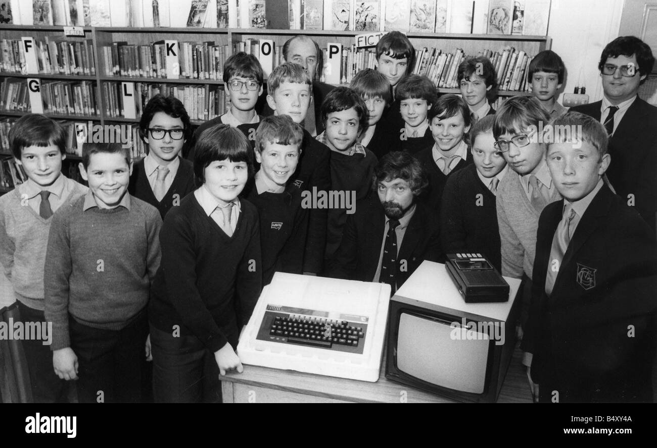 Children using computers Pupils at Gosforth Central Middle School so impressed organisers at an exhibition that they donated a computer to the school in 1983 Stock Photo