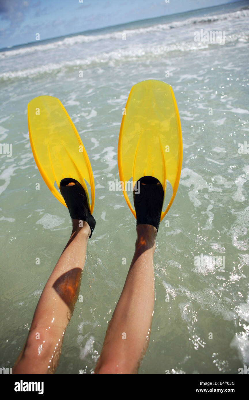 Person wearing flippers, low section Stock Photo Alamy