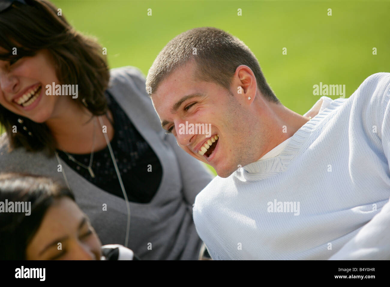 Friends hanging out at the park Stock Photo - Alamy