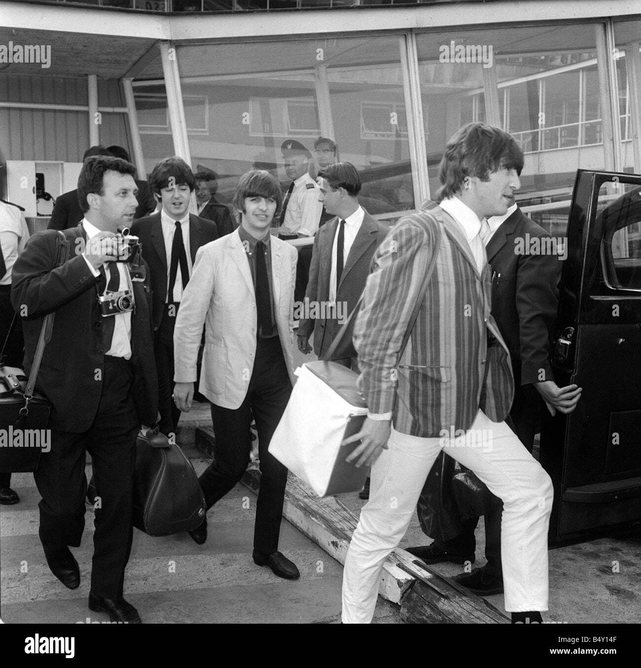 Pop Group The Beatles July 1964 John Lennon Paul McCartney George Harrison  Ringo Starr the beatles at London Airport after returning home from  performing in Stockholm Sweden Stock Photo - Alamy