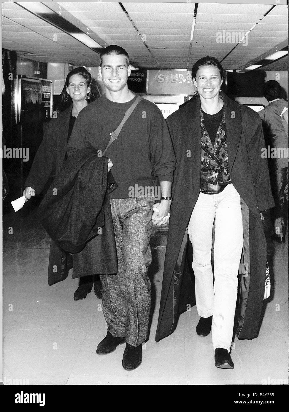 Tom Cruise actor seen with his wife at London Airport Stock Photo