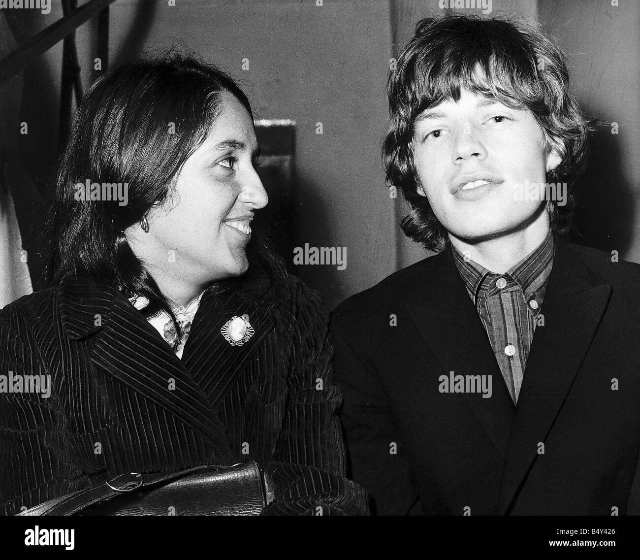 Joan Baez American folk singer famous for protest songs anti Vietnam war meets Mick Jagger Pop Singer of the Rolling Stones in Glasgow in 1965 Stock Photo