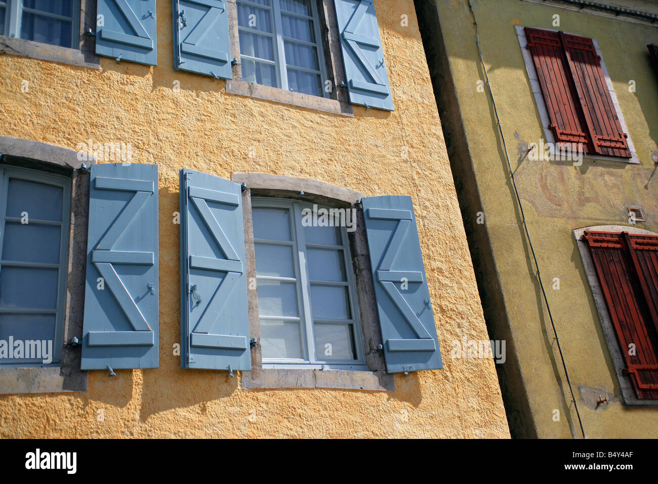 houses facades with windows and wood shutters Stock Photo - Alamy