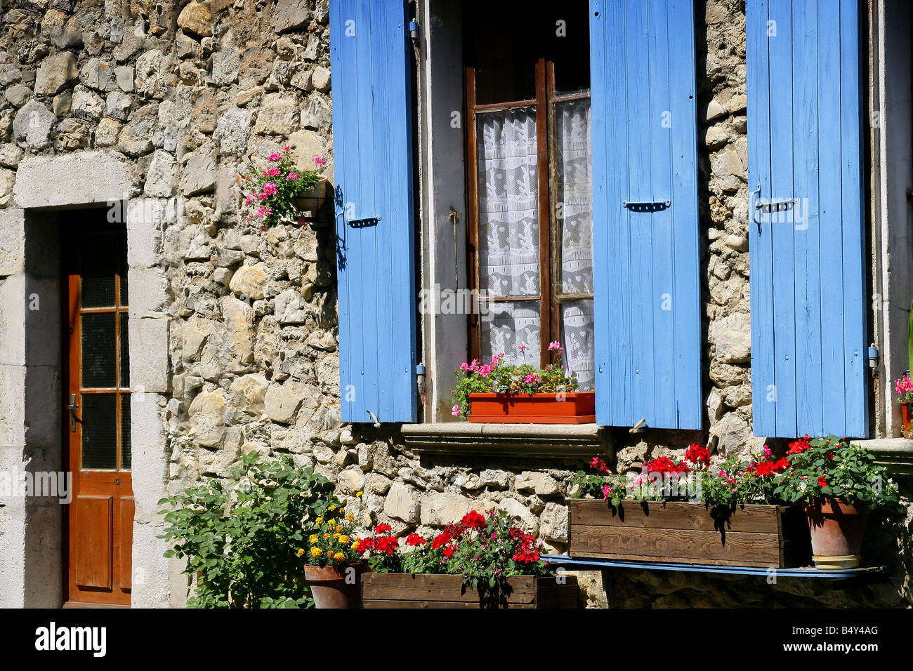 houses facades with windows and wood shutters Stock Photo - Alamy