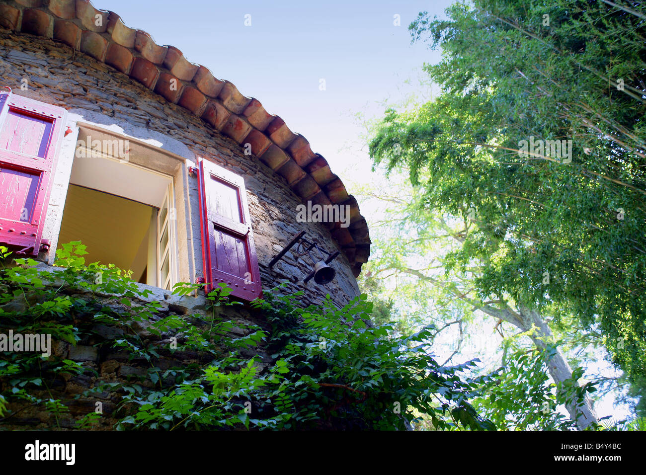 stone house facade with window and wood shutters Stock Photo - Alamy