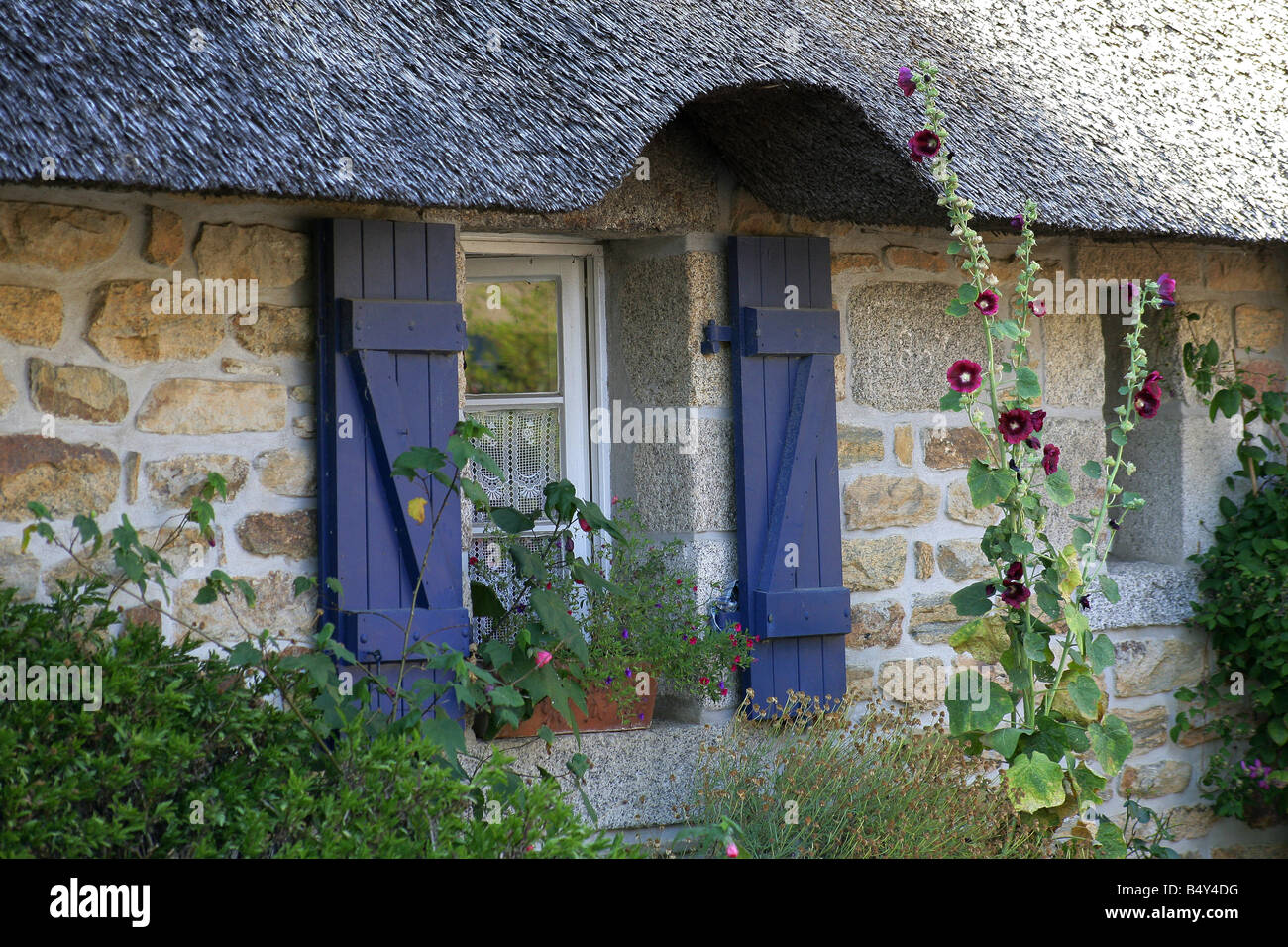 stone house facade with window and wood shutters Stock Photo - Alamy