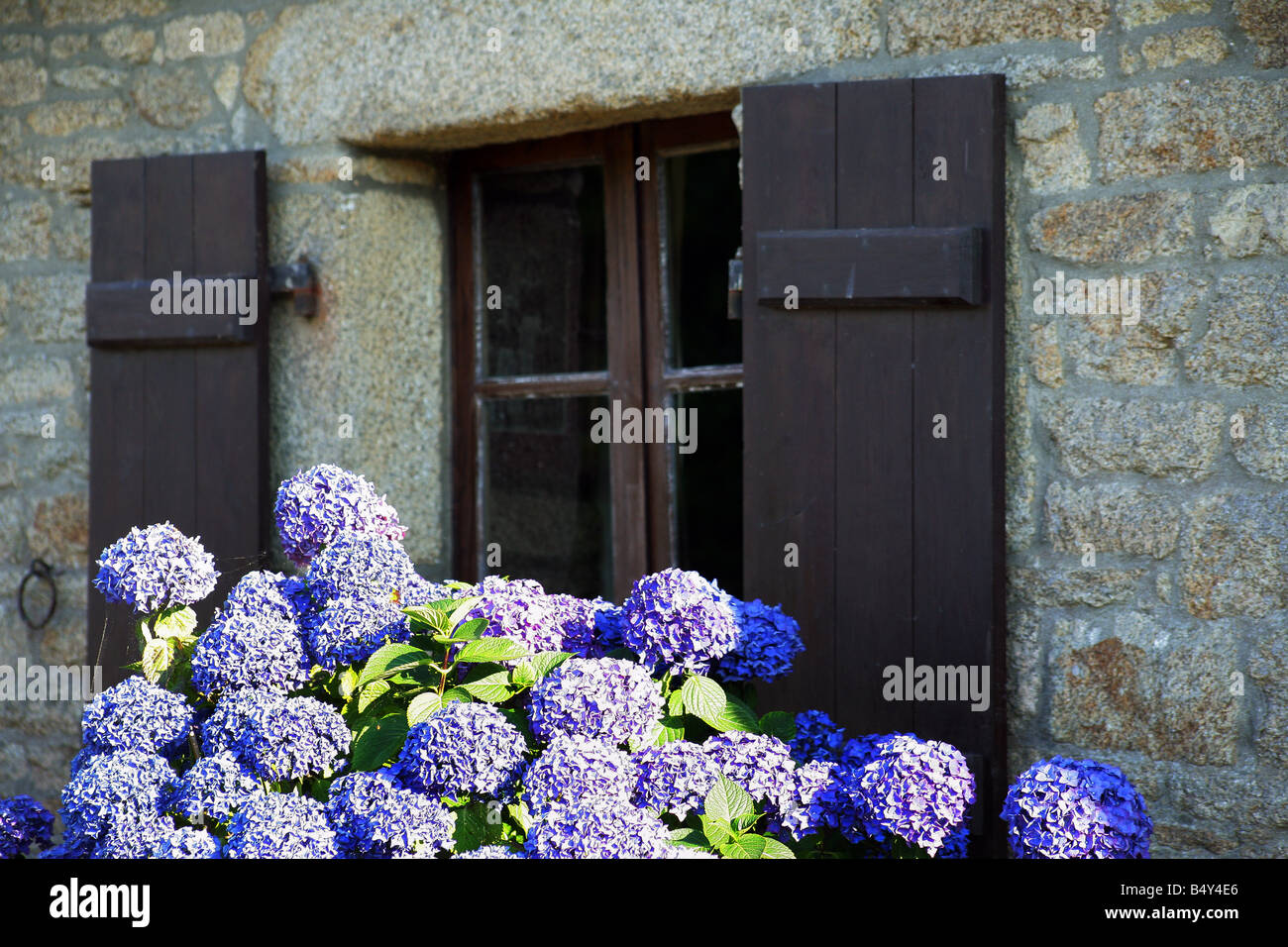 stone house facade with window and wood shutters Stock Photo - Alamy