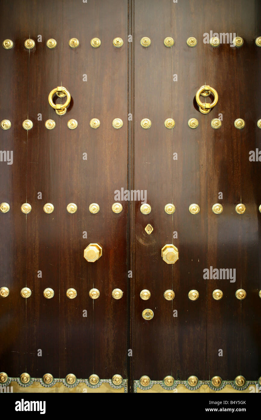 Golden door knockers on door, closeup Stock Photo Alamy