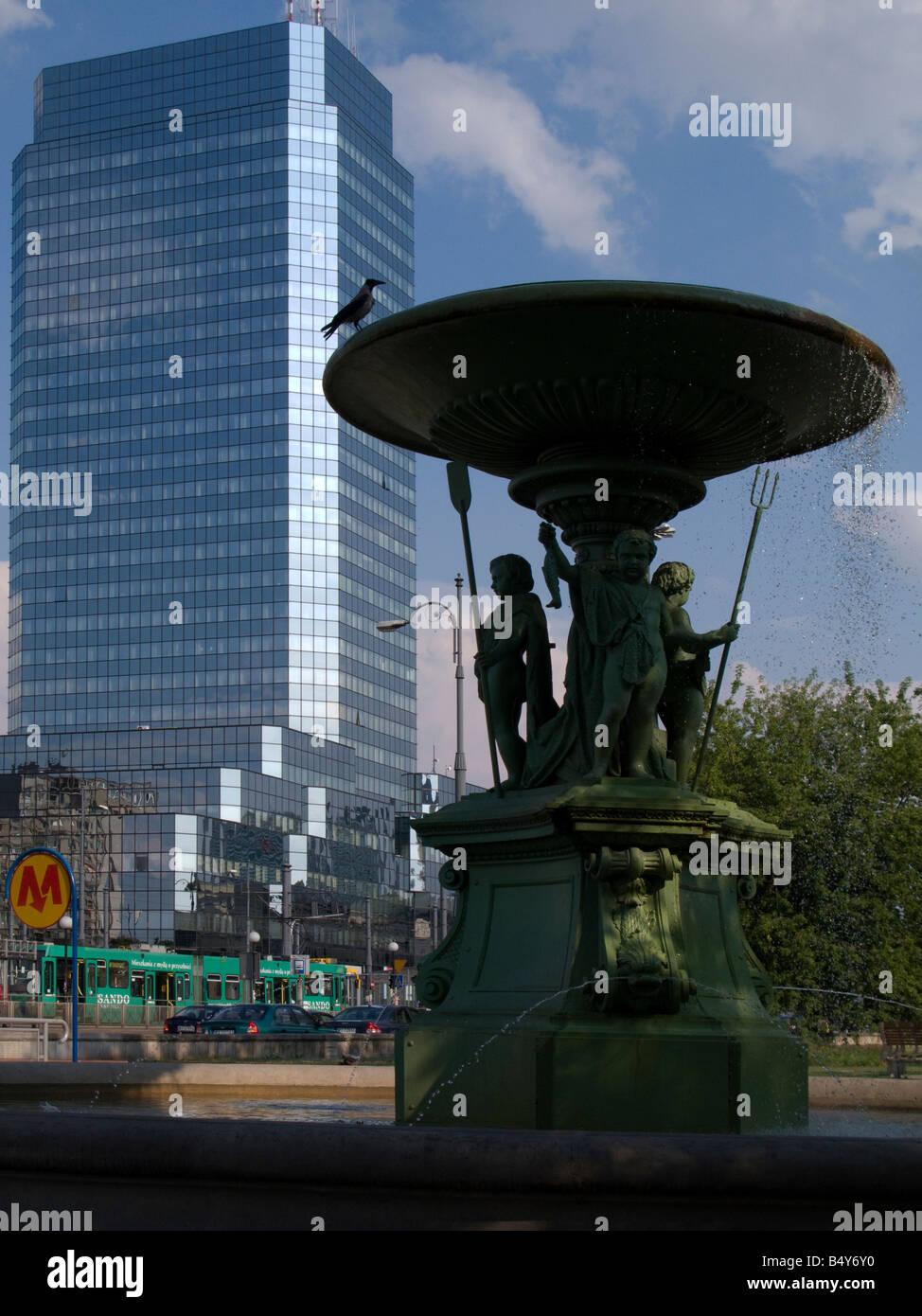 modern skyscraper and old fountain in Warsaw, Poland Stock Photo