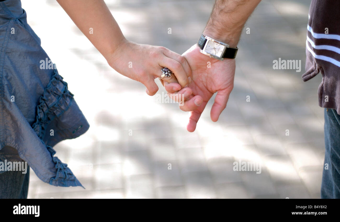 Boy and girl walking holding hands hi-res stock photography and images ...