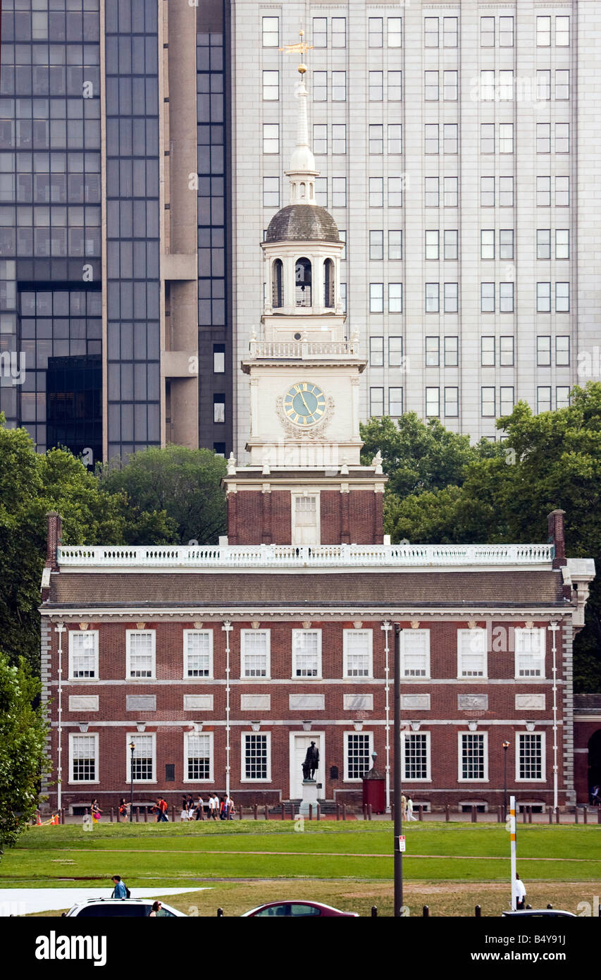 Front view of Independence Hall with tall city buildings of Philadelphia in the background. Stock Photo
