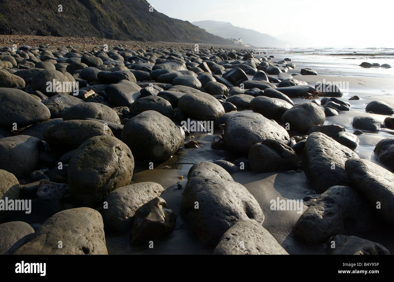 Charmouth Beach in Dorset showing large stones Stock Photo