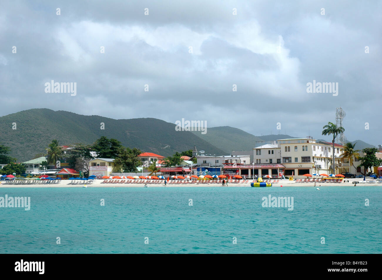 view of philipsburg st maarten/st martin from the water showing the beach, shopping district and surrounding hills Stock Photo