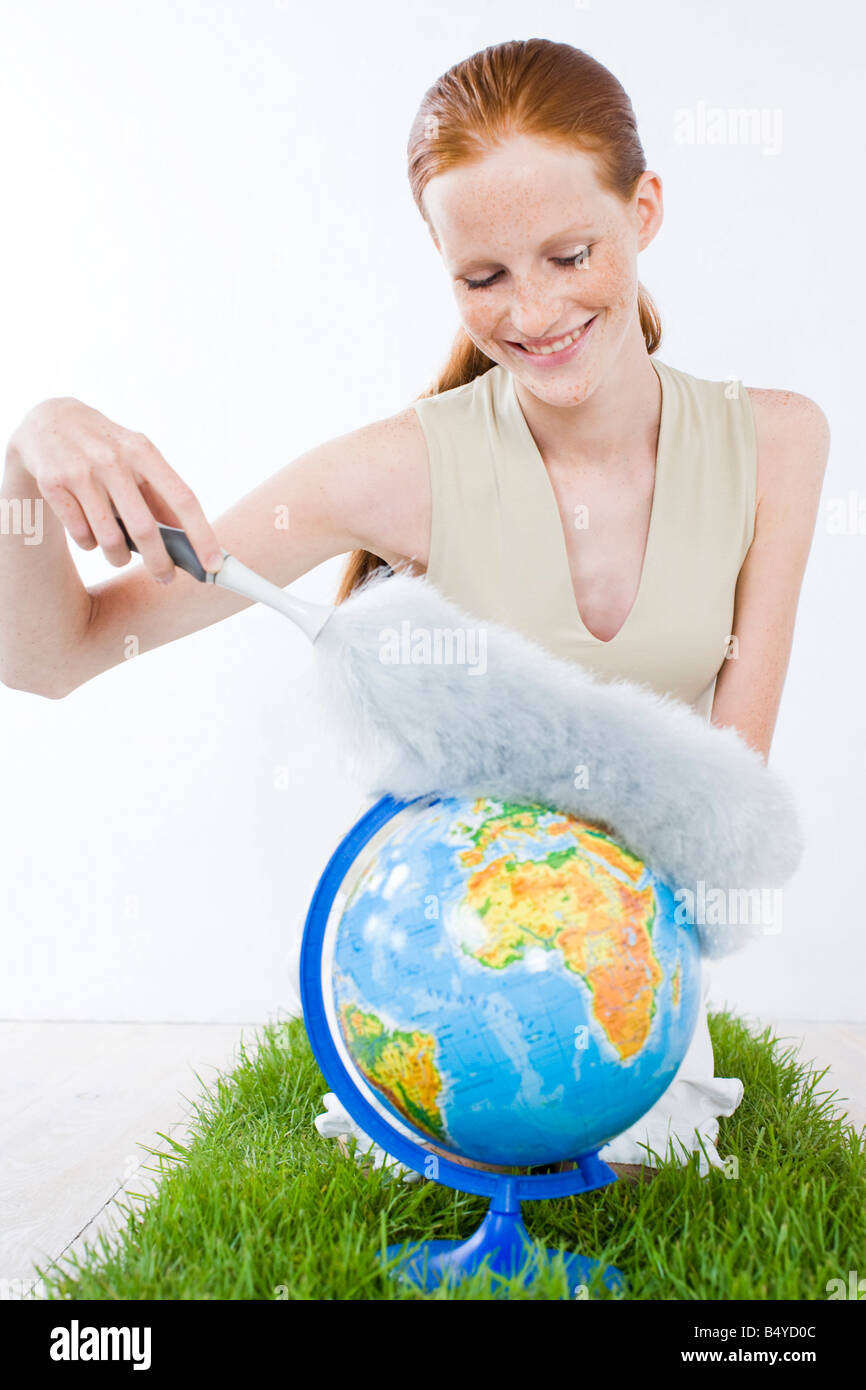 young woman cleaning earth Stock Photo