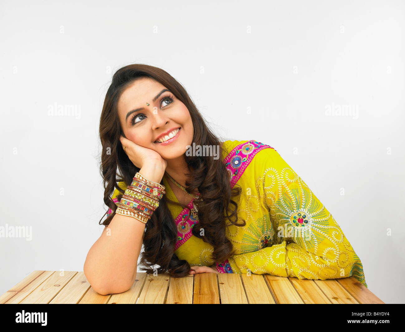 indian woman origin in her traditional dress posing in front of the camers Stock Photo