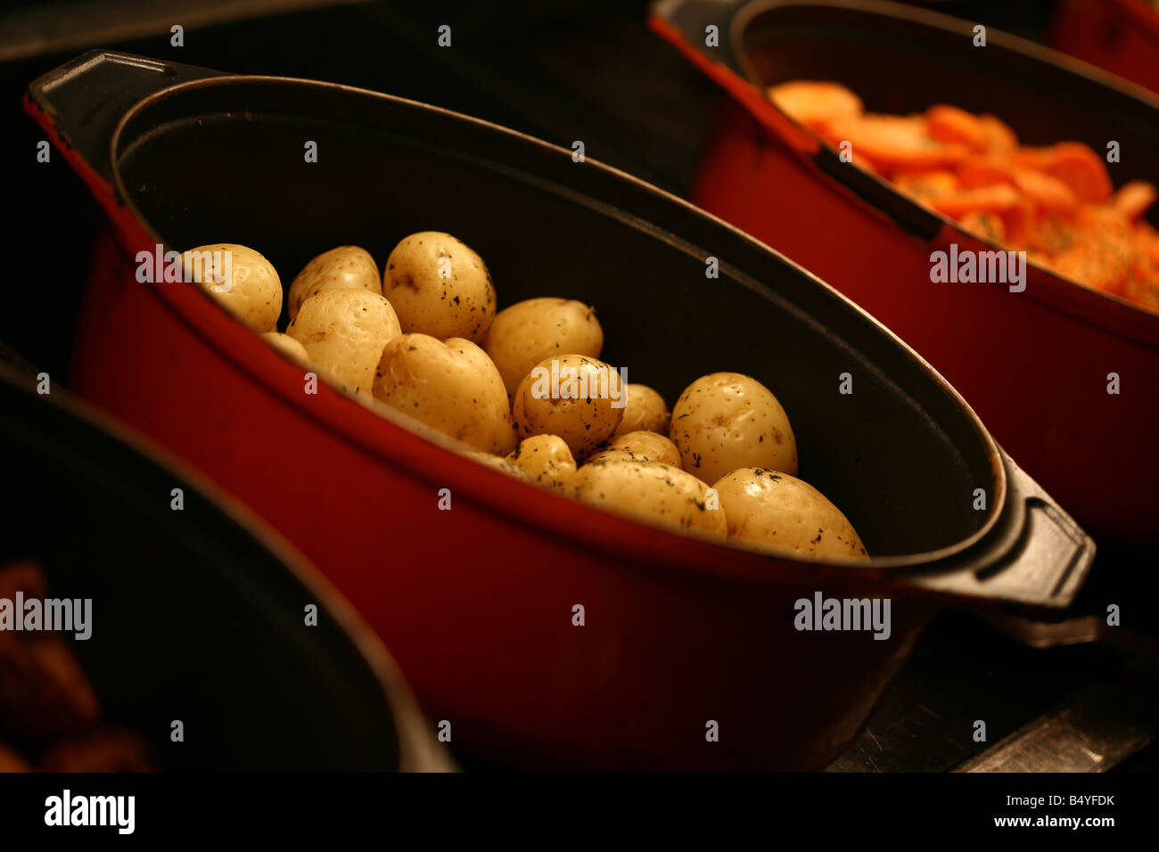 Boiled potatoes and carrots at a traditional carvery pub Stock Photo