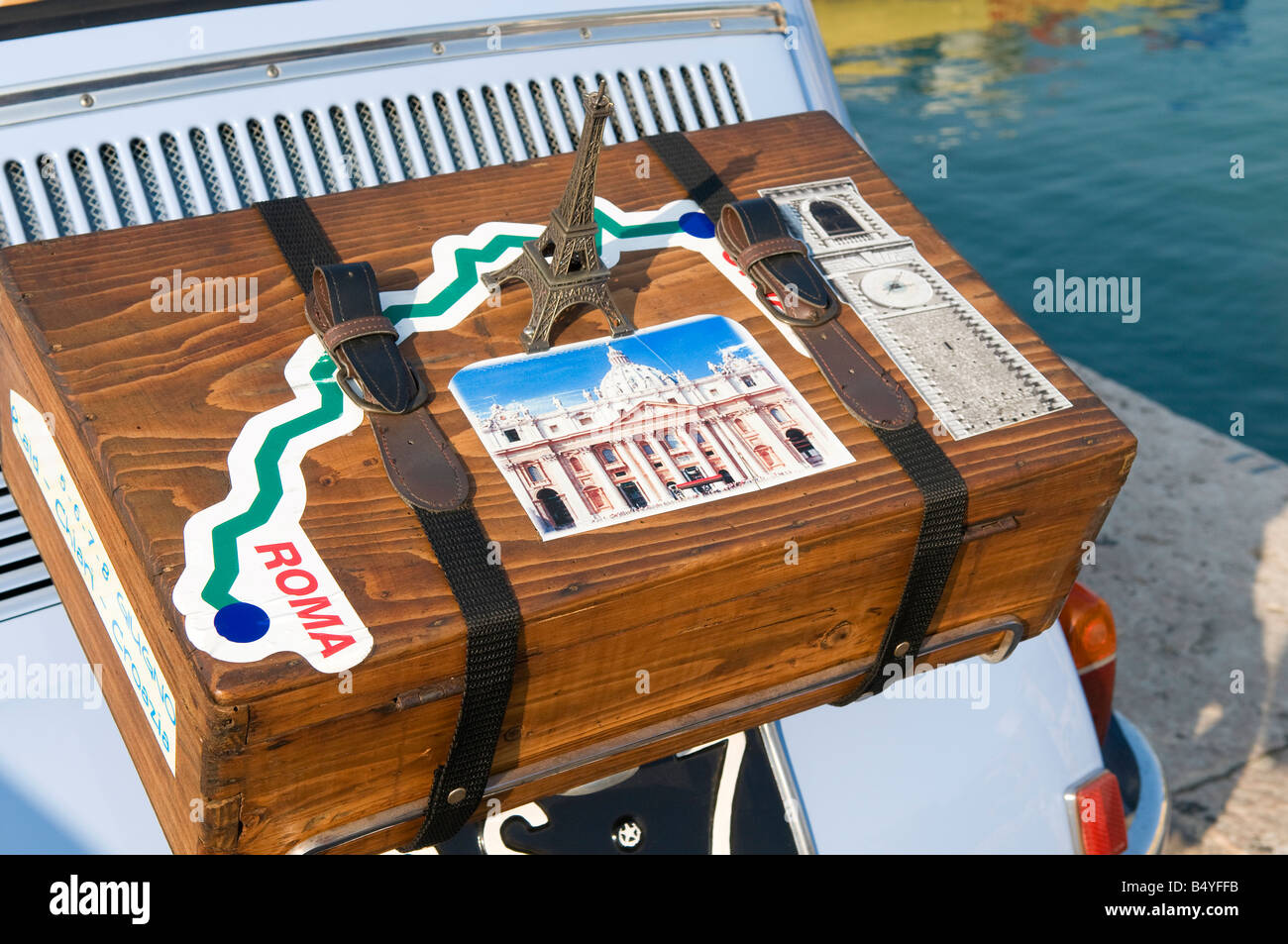 old suitcase strapped to fiat 500, lake garda, italy Stock Photo