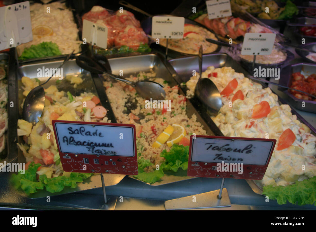 Various prepared salads on sale in a deli in Senlis Stock Photo