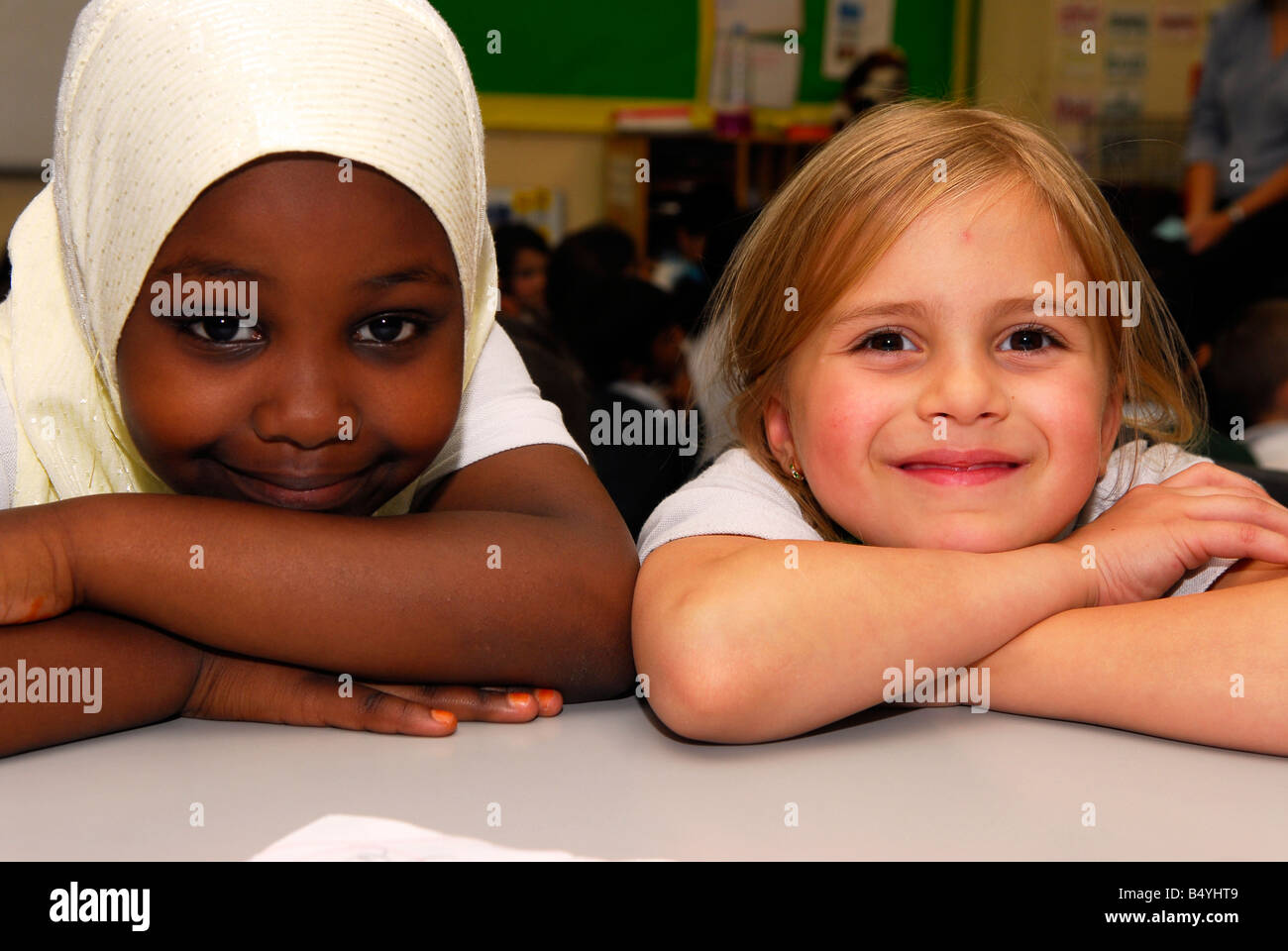Two 6 year old female school pupils, Cranford, Middlesex UK Stock Photo