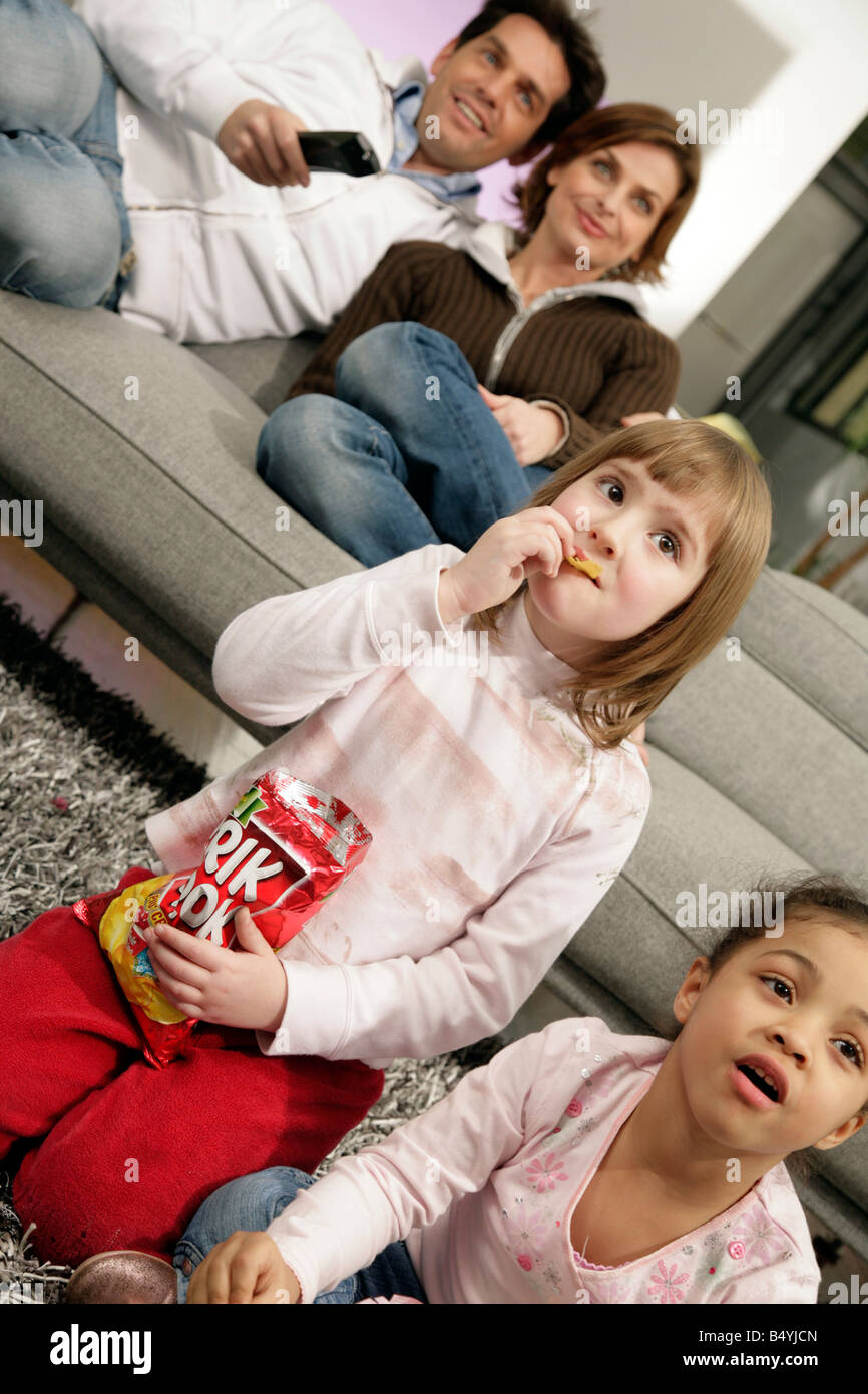 family in living room Stock Photo Alamy