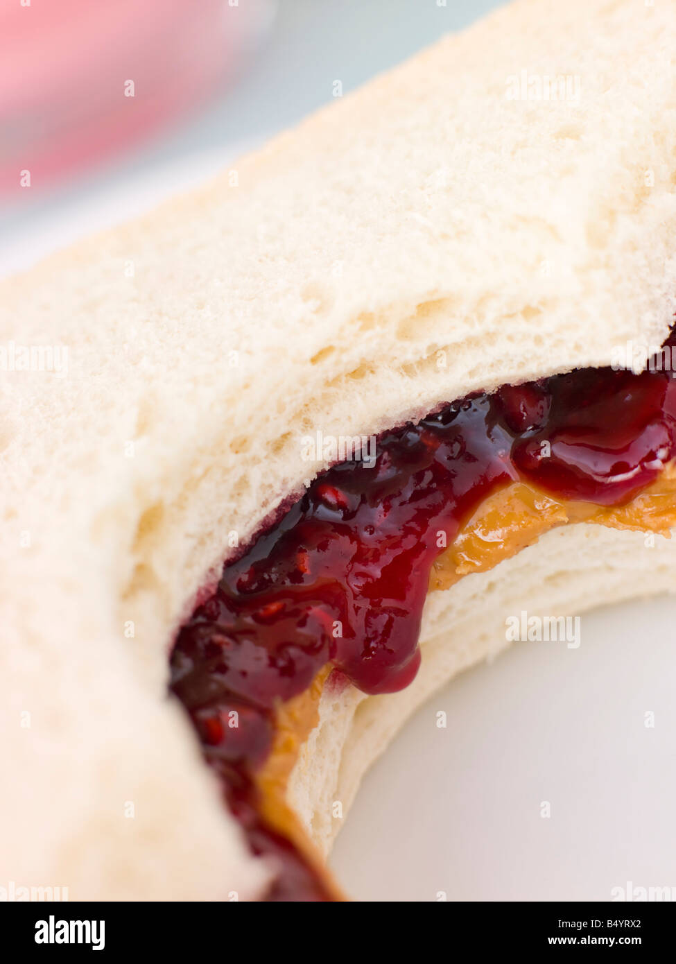 Peanut Butter And Raspberry Jelly Sandwich On White Bread Stock Photo ...