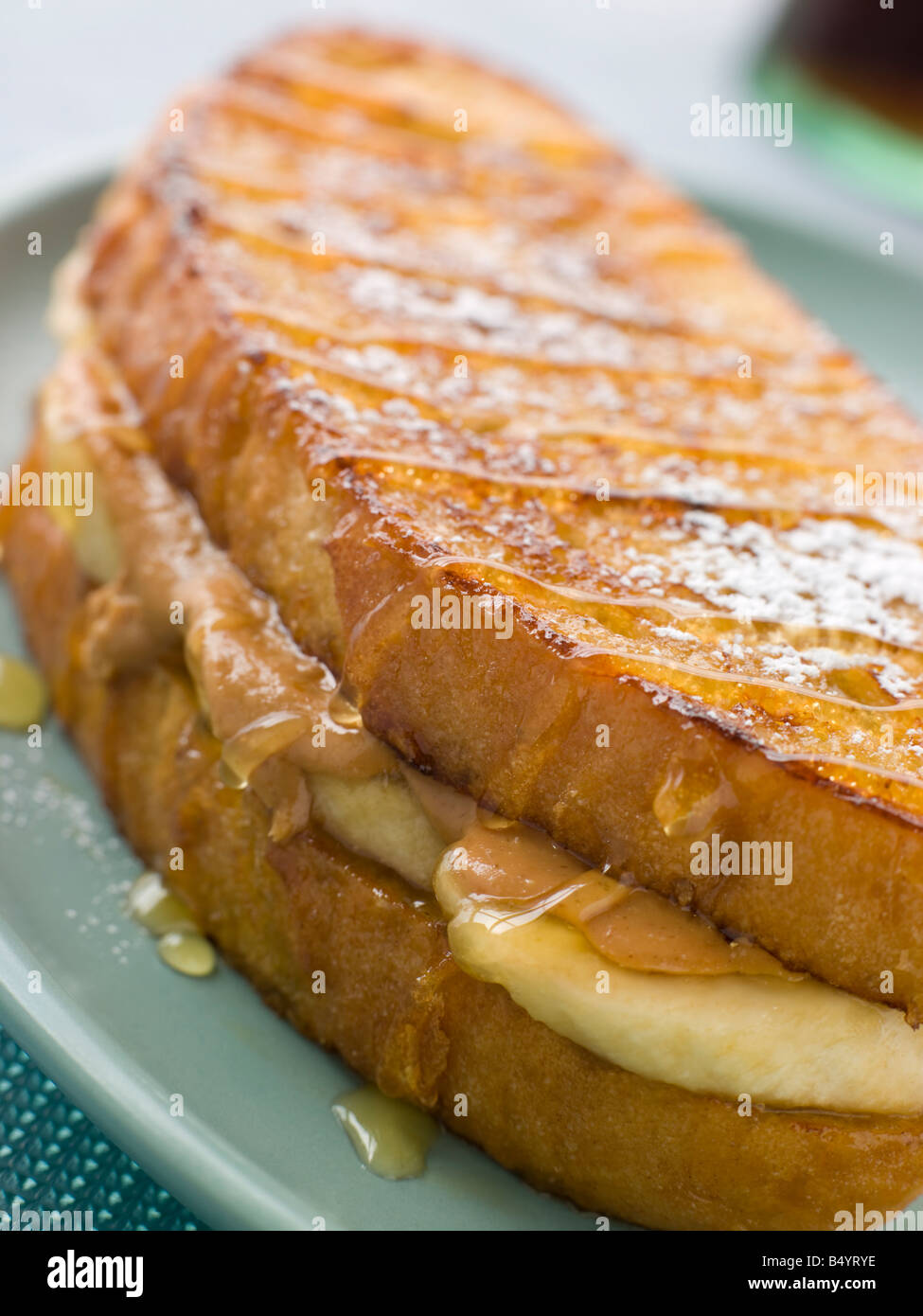 Peanut Butter And Banana Eggy Bread Sandwich With Syrup Stock Photo
