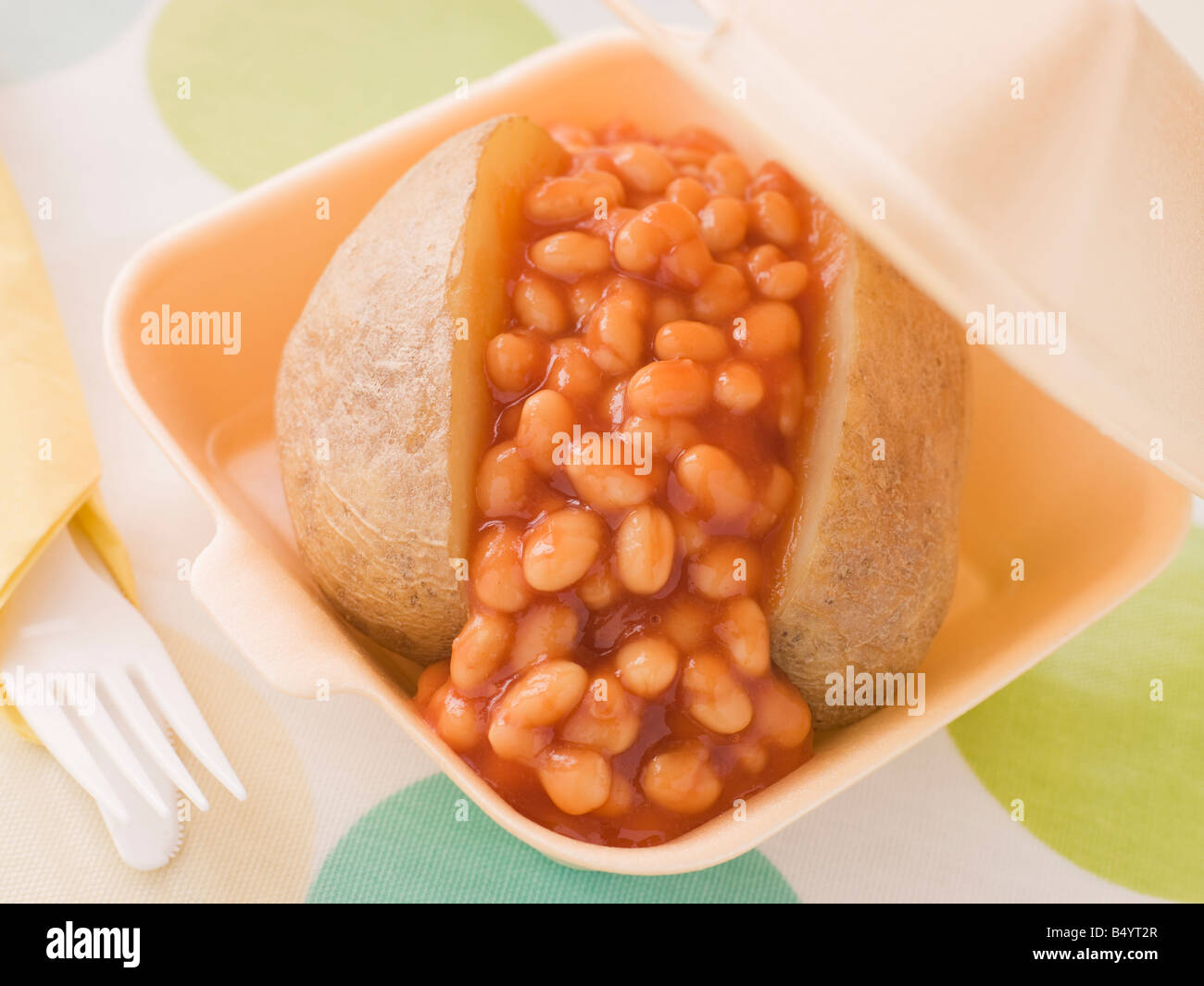 Baked Potato With Baked Beans In A Take Away Box Stock Photo Alamy