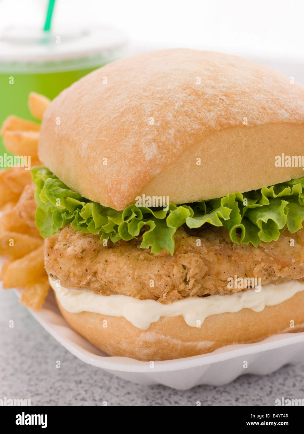 Southern Fried Chicken Fillet Burger With Fries And A Soft Drink Stock