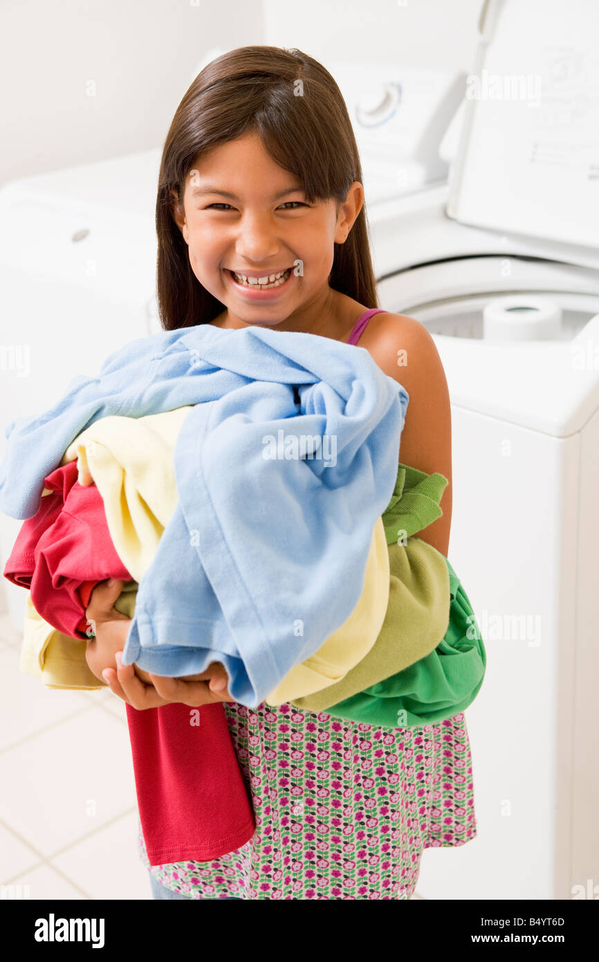 Young Girl Doing Laundry Stock Photo