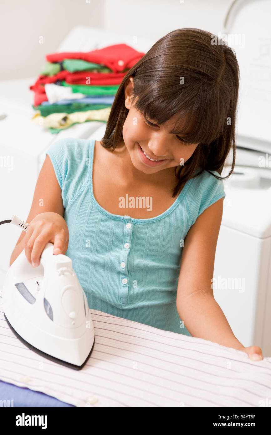 Young Girl Ironing Stock Photo
