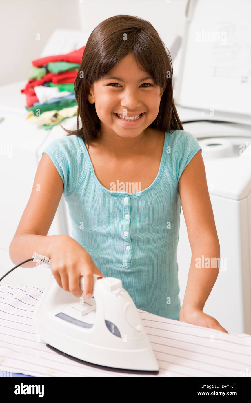 Young Girl Ironing Stock Photo