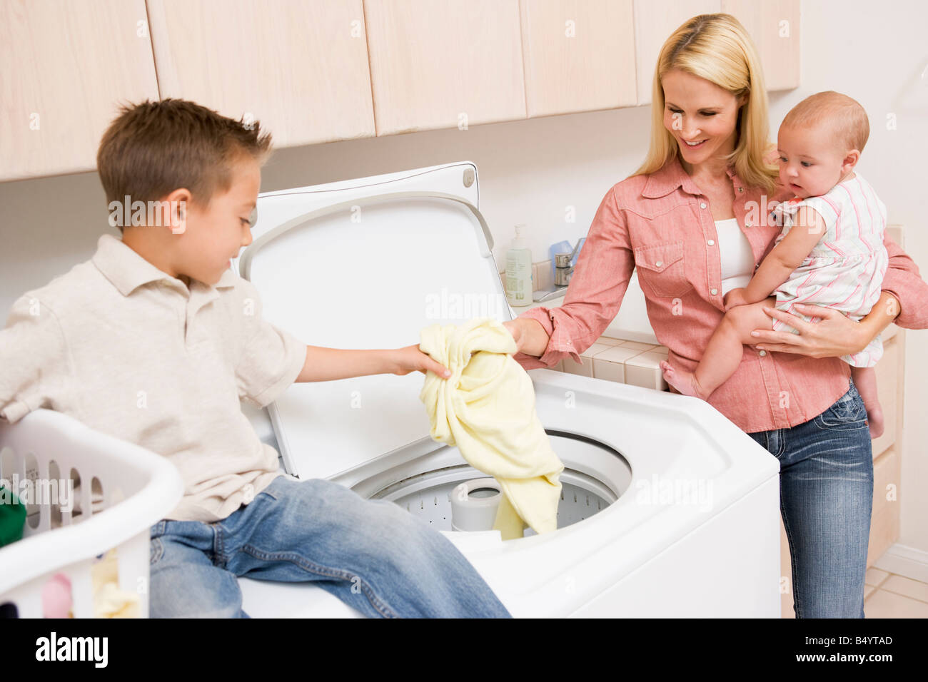 Mother And Children Doing Laundry Stock Photo Alamy