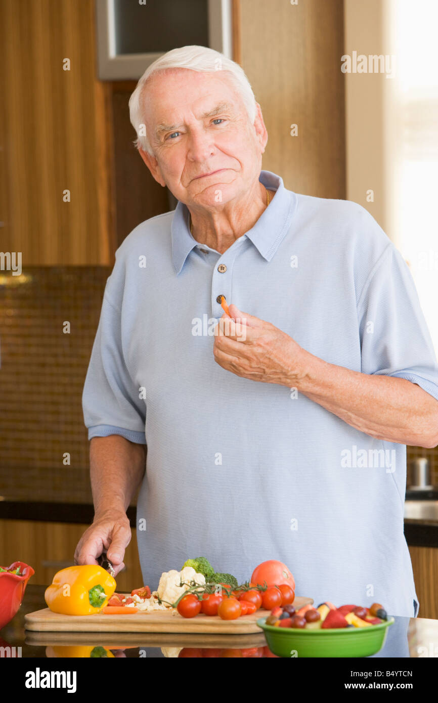 Man Cutting Up Vegetables Stock Photo