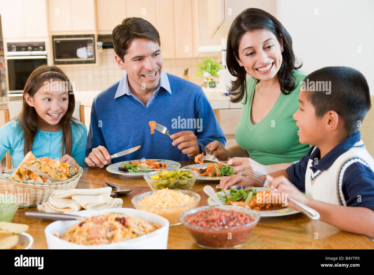 Family Enjoying Meal Together Stock Photo Alamy