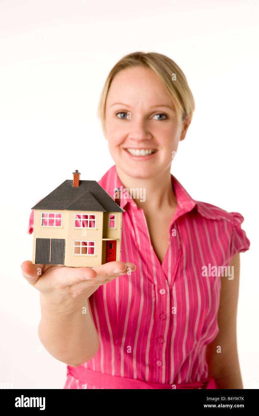 Businesswoman Holding Small House Stock Photo