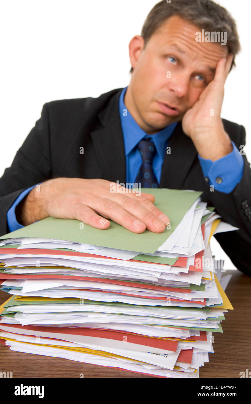Businessman Overwhelmed By Paperwork Stock Photo