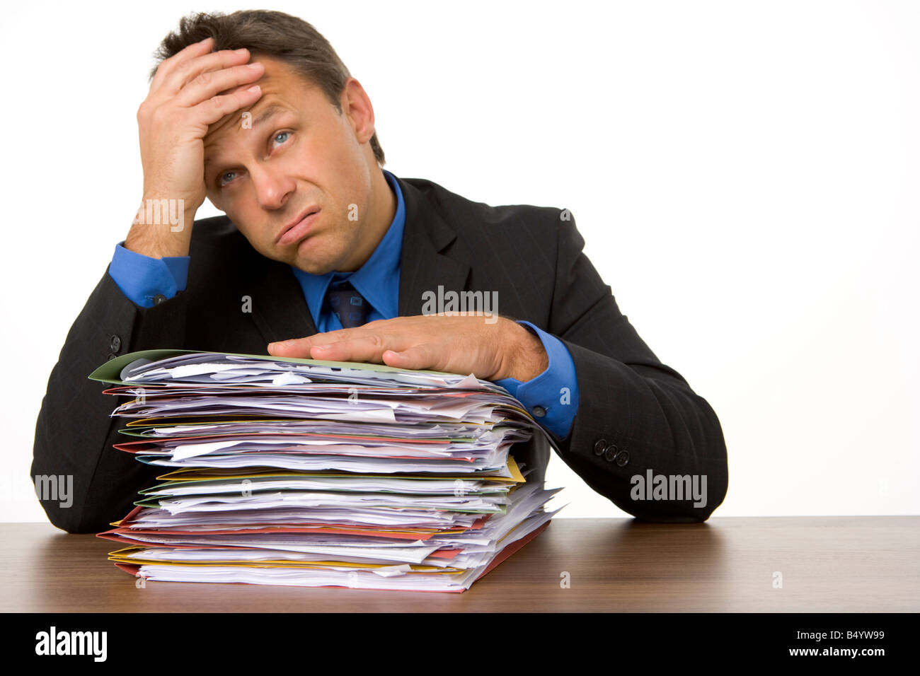 Businessman Overwhelmed By Paperwork Stock Photo