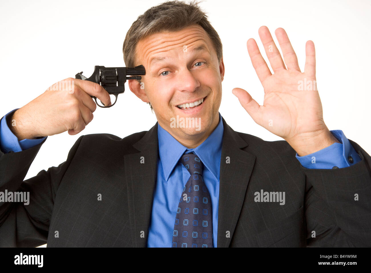 businessman-holding-gun-to-his-head-while-smiling-and-waving-B4YW9M.jpg