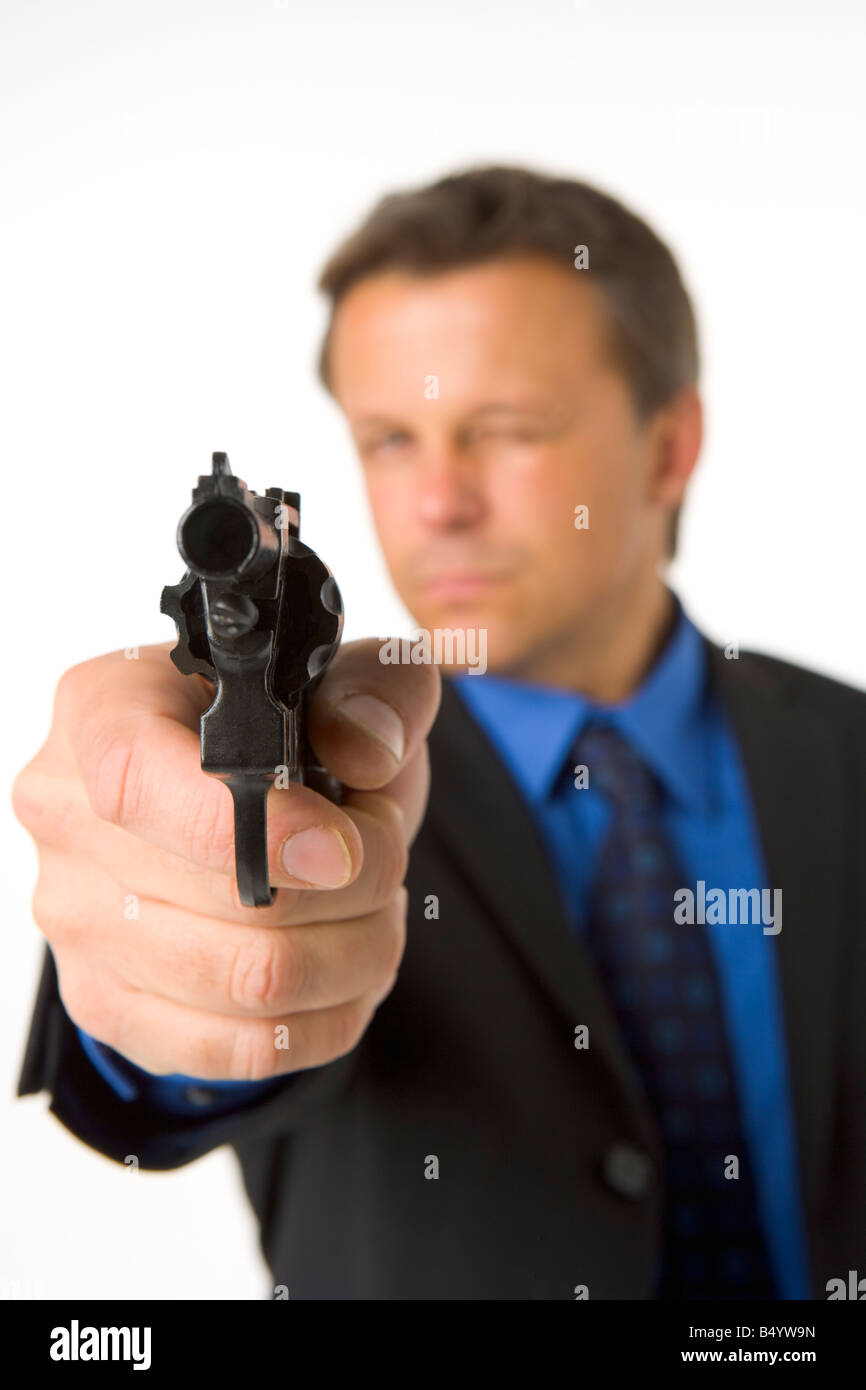 Businessman Pointing Hand Gun Stock Photo